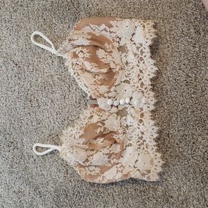 Nude and white For Love and Lemons cropped busiter in size S.